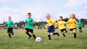 team_of_young_footballers_football_match_team_juniors_football_field_lawn_b-1551231636983-300x170.jpg
