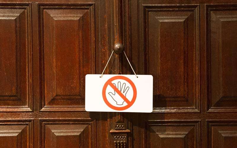 9-No-entry-or-dont-touch-sign-on-an-old-door.jpg